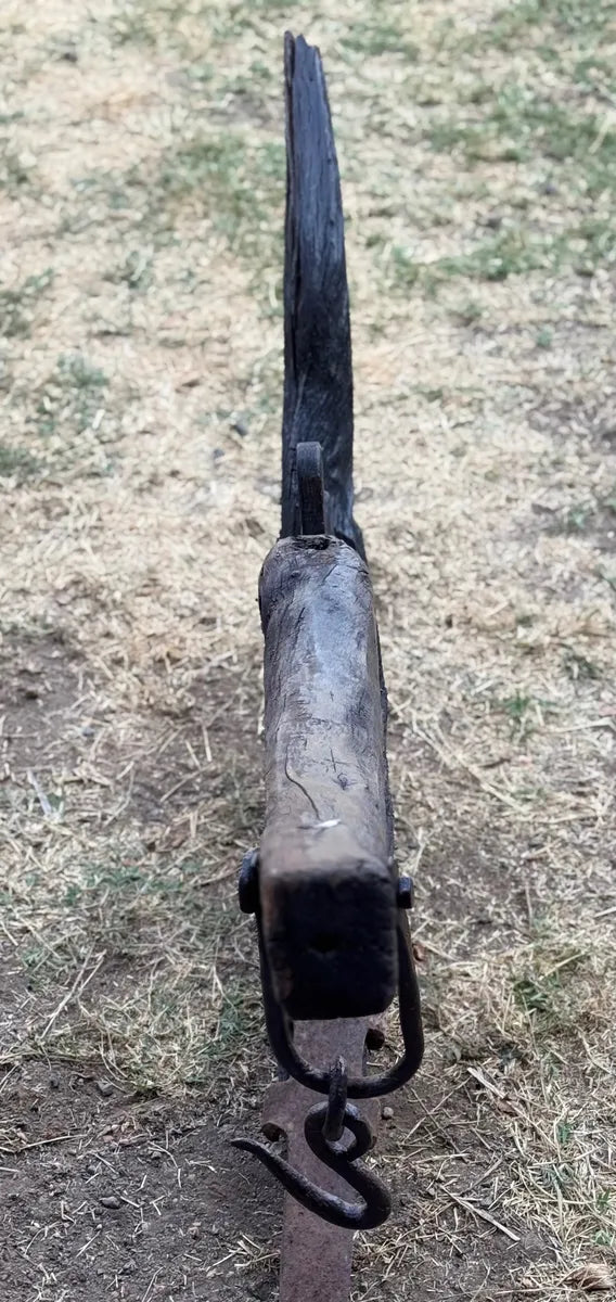 Old and original wooden plow with a share