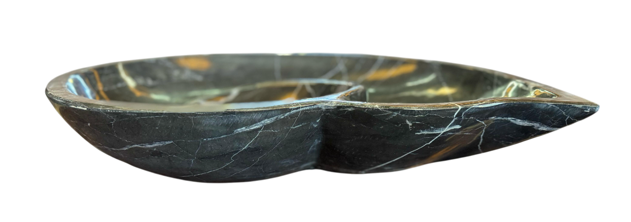 Black marble sink in the shape of a snail fossil