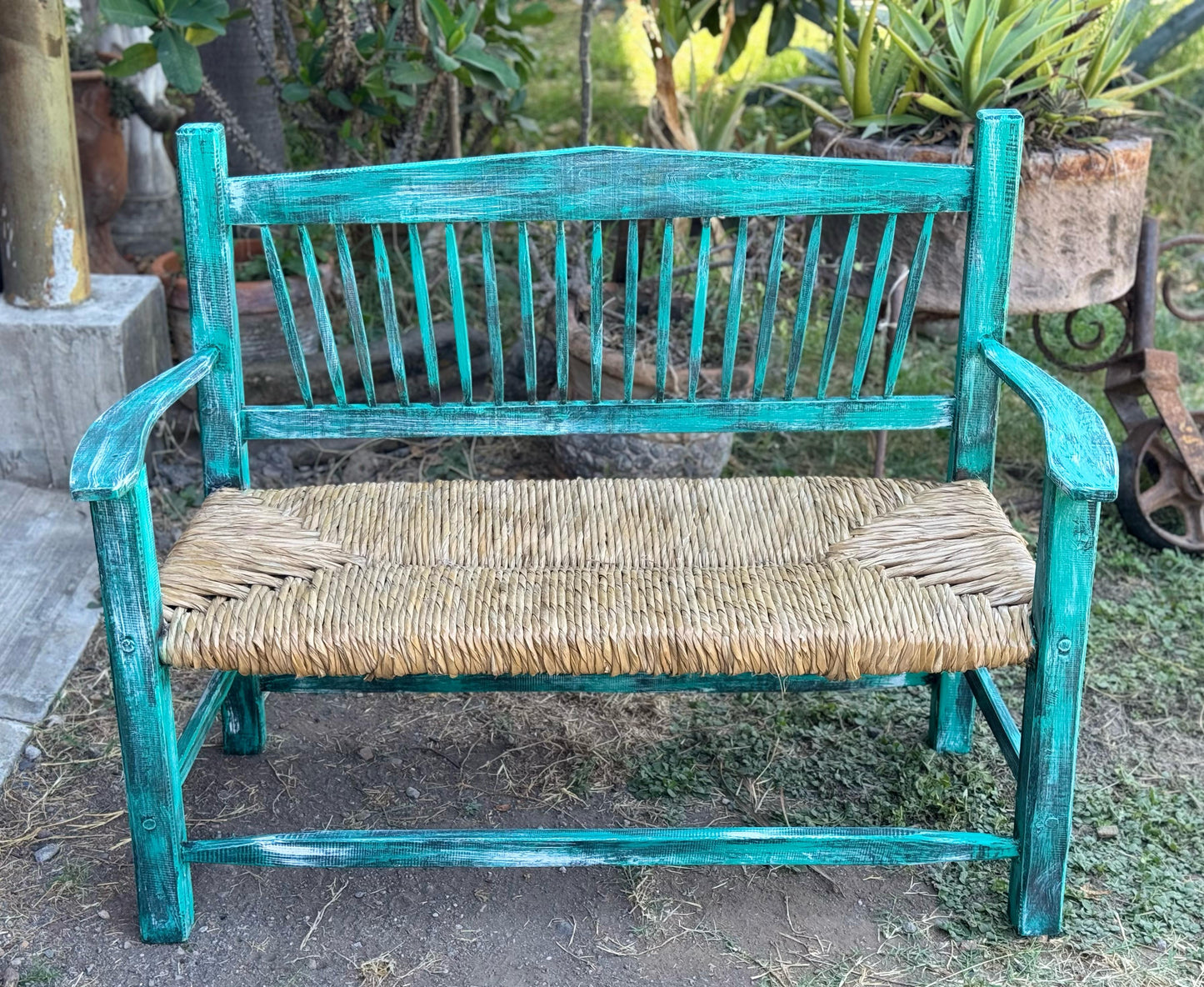 Handcrafted solid wood bench with tule woven seat