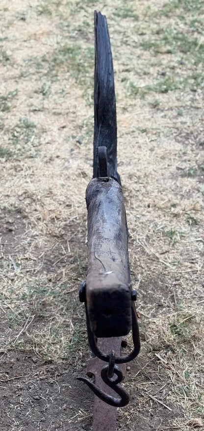 Old and original wooden plow with a share