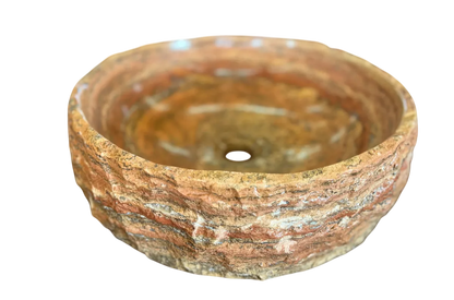 Round countertop sink in fine antique-style marble. 