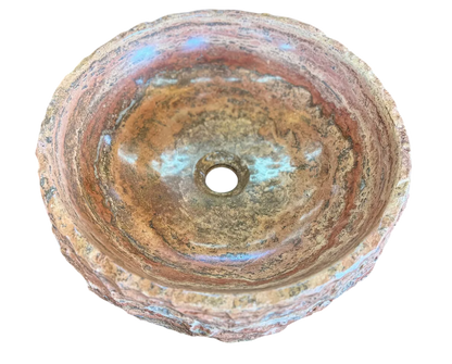 Round countertop sink in fine antique-style marble. 