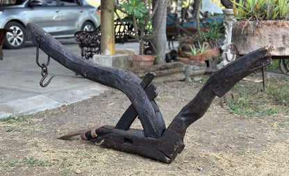 Old and original wooden plow with a share