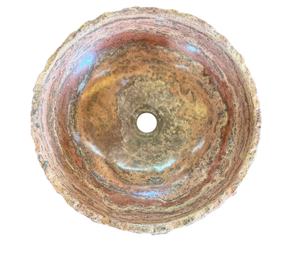 Round countertop sink in fine antique-style marble. 